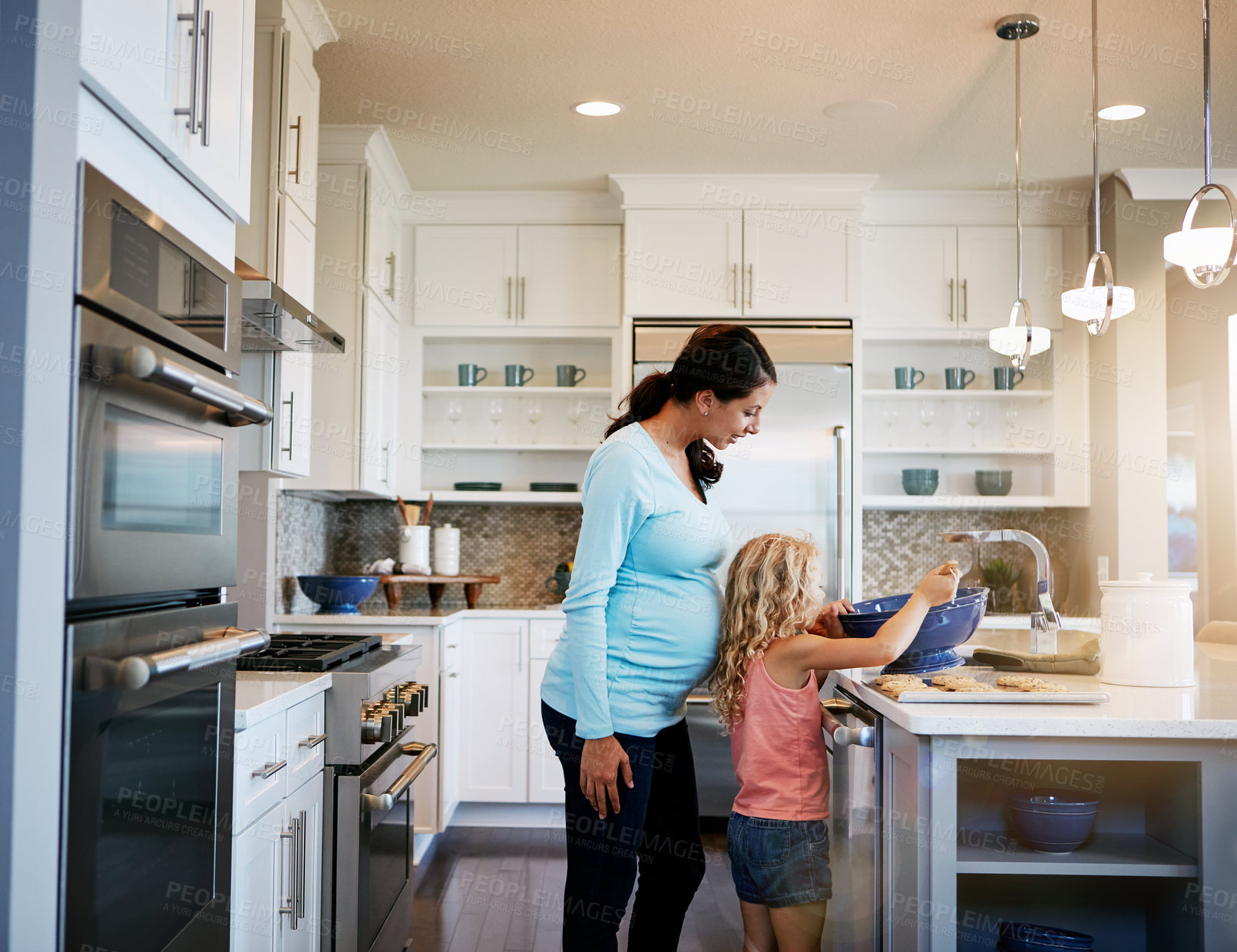 Buy stock photo Mother, daughter and cookies or helping with baking in kitchen for teaching, cooking and bonding in home. Family, pregnant woman and girl with learning to cook a cake and sweet snack in apartment