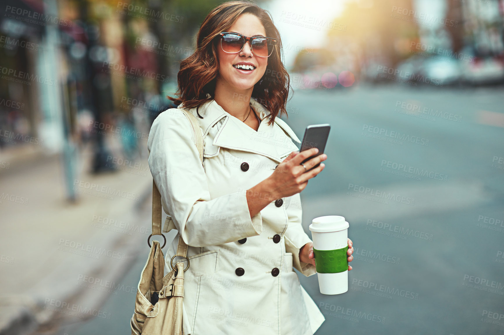 Buy stock photo Cropped shot of a happy young woman going for a walk around the city