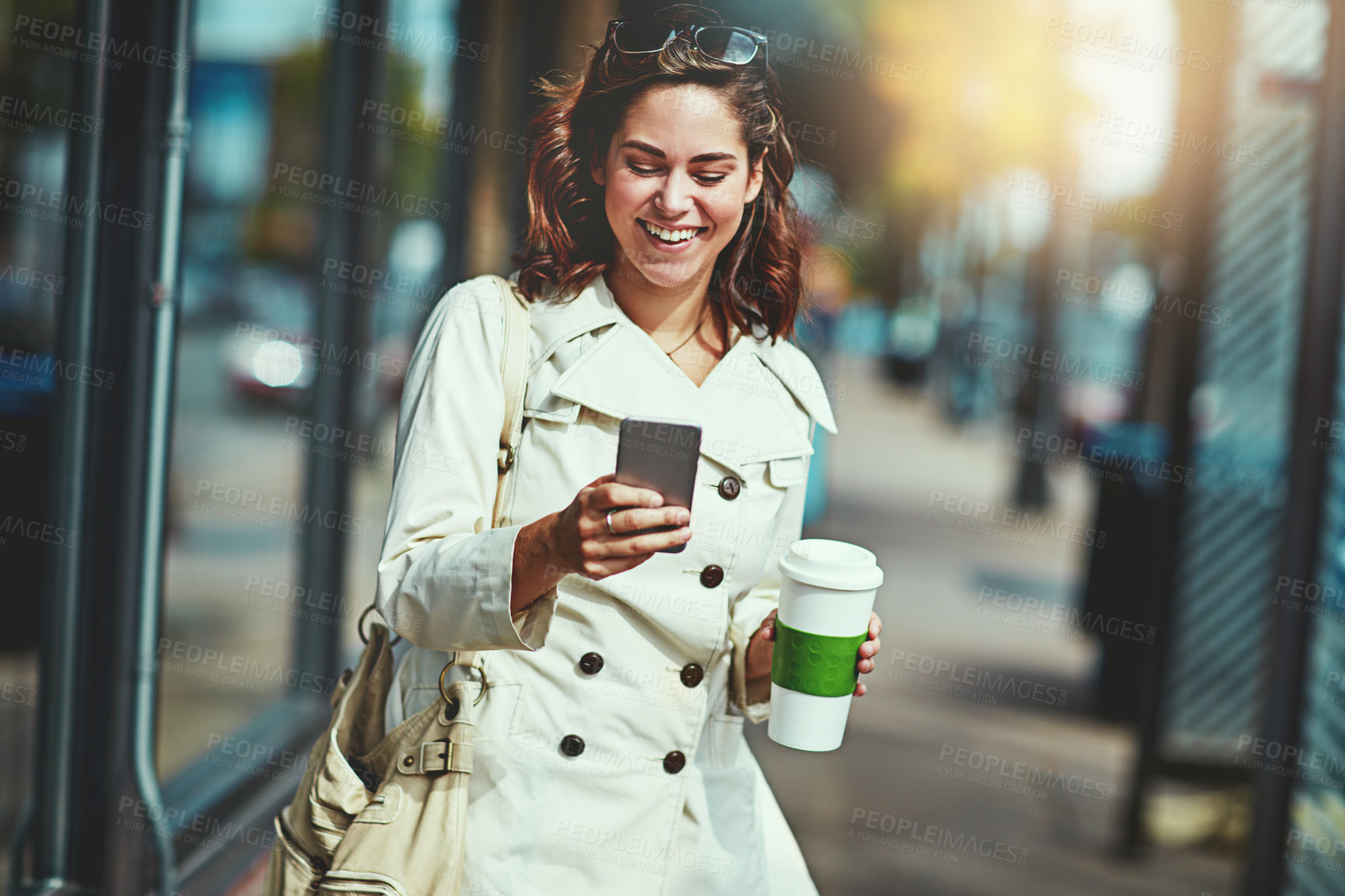 Buy stock photo Cropped shot of a happy young woman going for a walk around the city