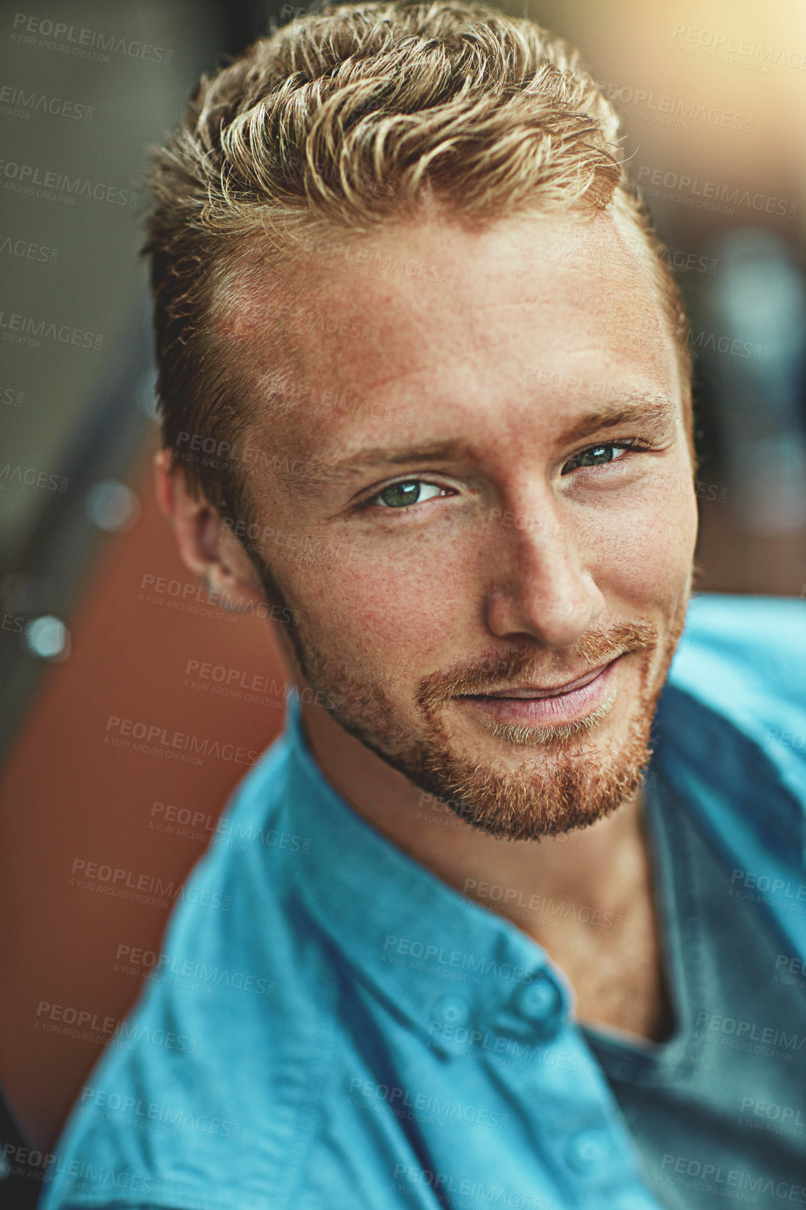 Buy stock photo Portrait of a smiling young man posing alone outside