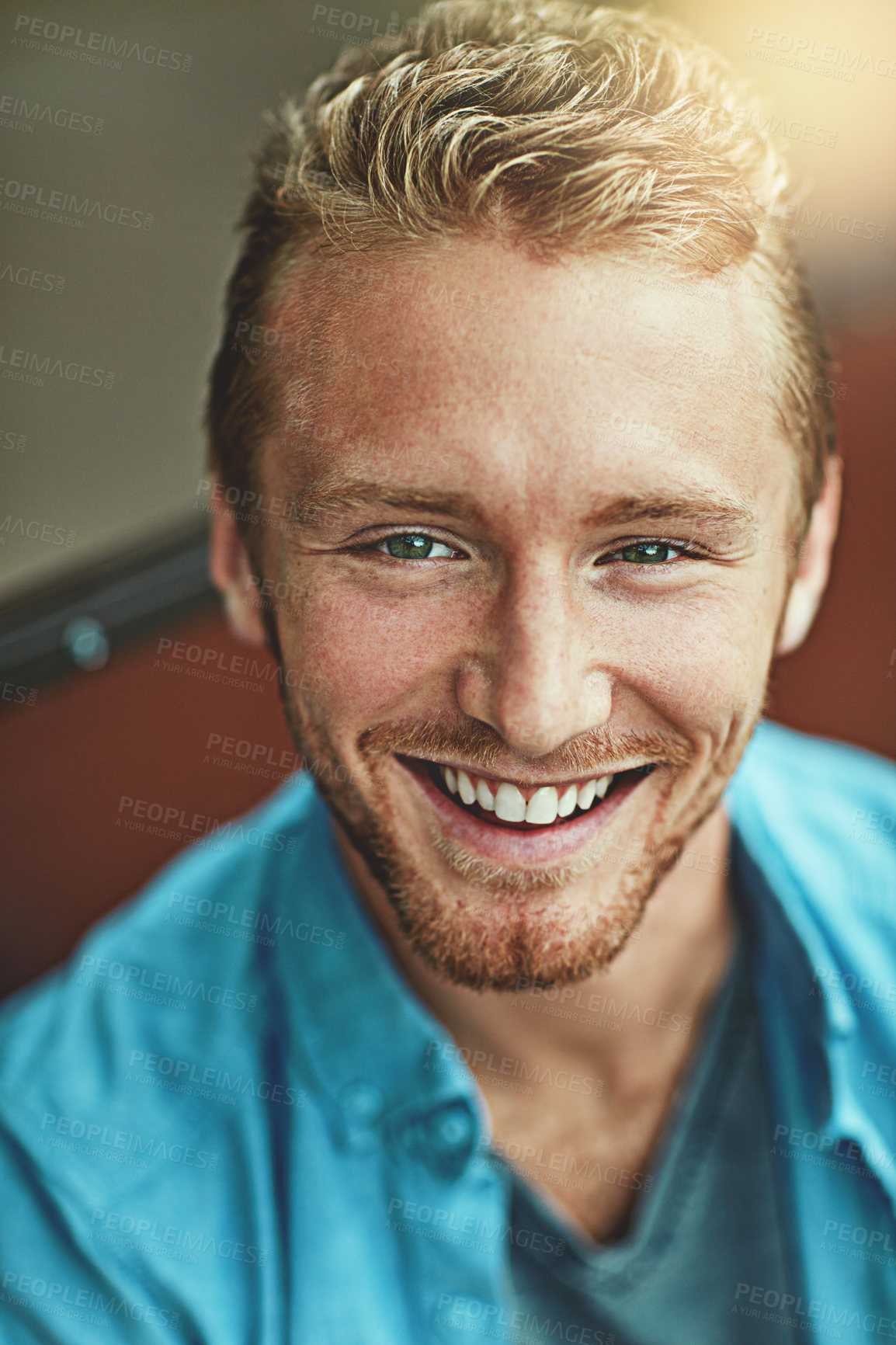 Buy stock photo Portrait of a smiling young man posing alone outside