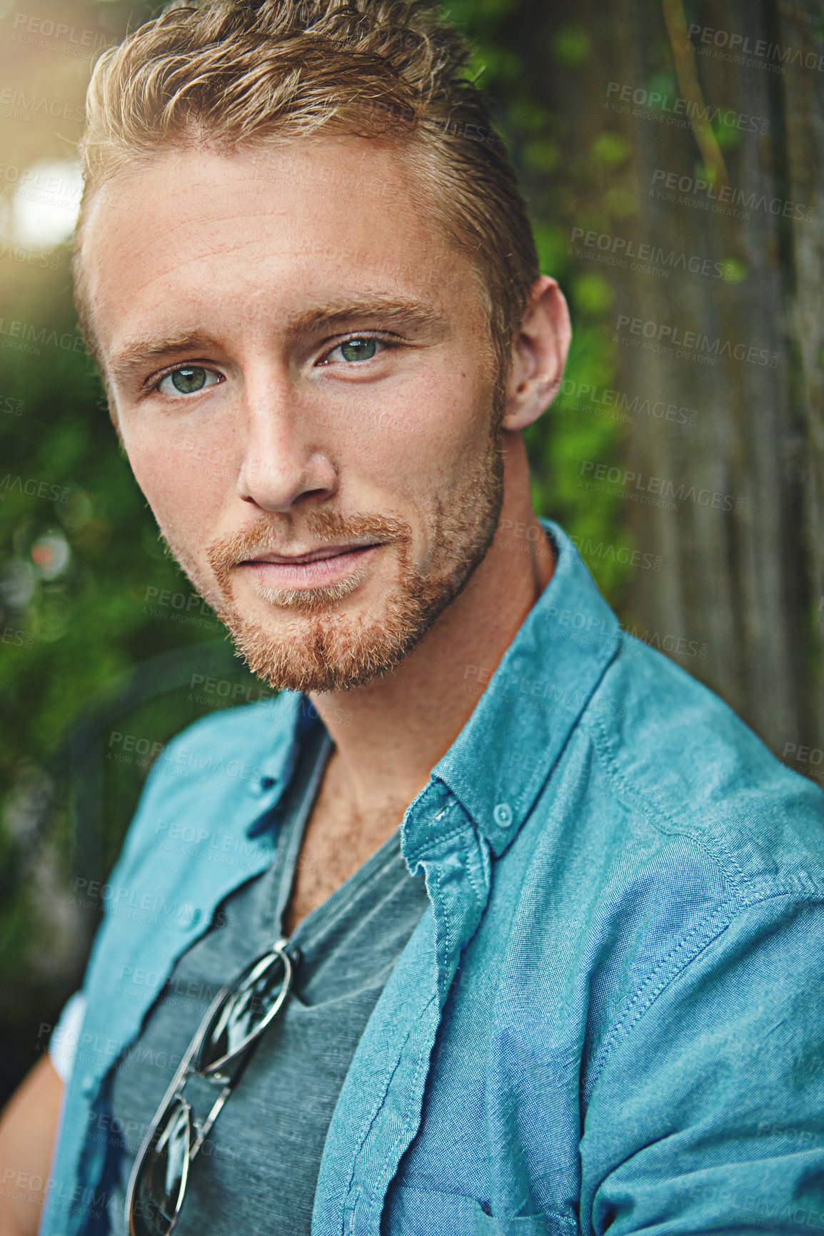 Buy stock photo Cropped portrait of a handsome young man outdoors