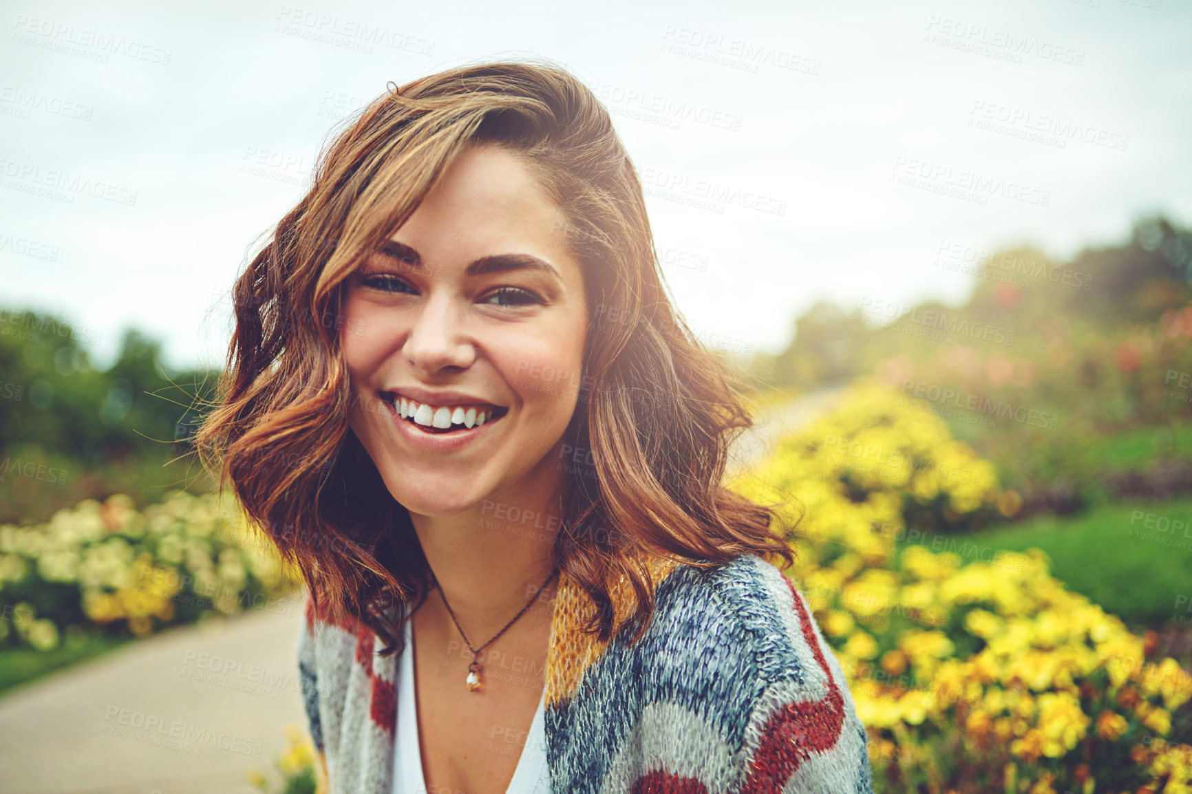 Buy stock photo Portrait of an attractive young woman enjoying a spring day outdoors