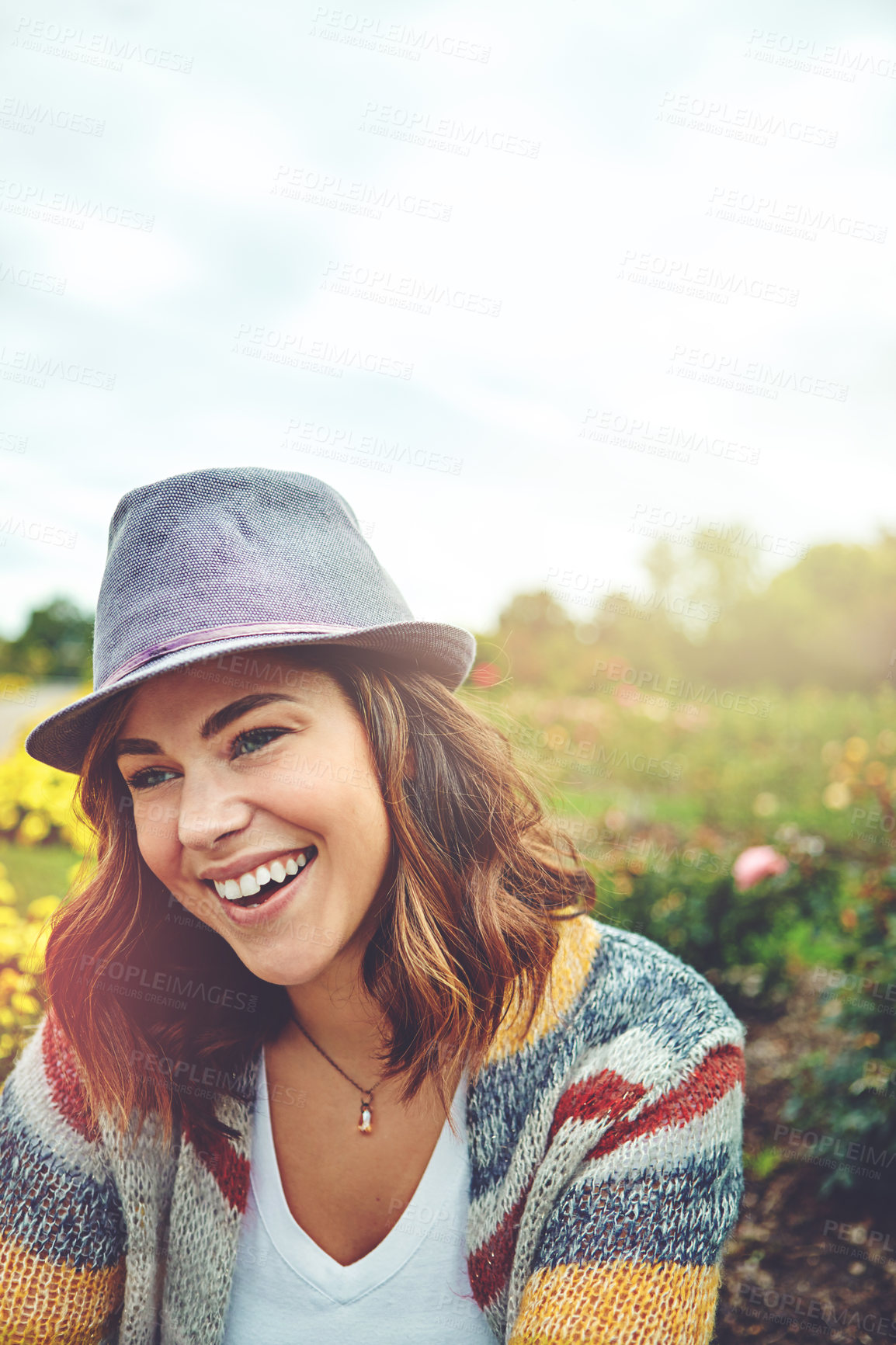 Buy stock photo Shot of an attractive young woman enjoying a spring day outdoors