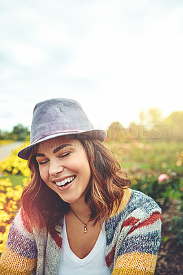 Buy stock photo Shot of an attractive young woman enjoying a spring day outdoors
