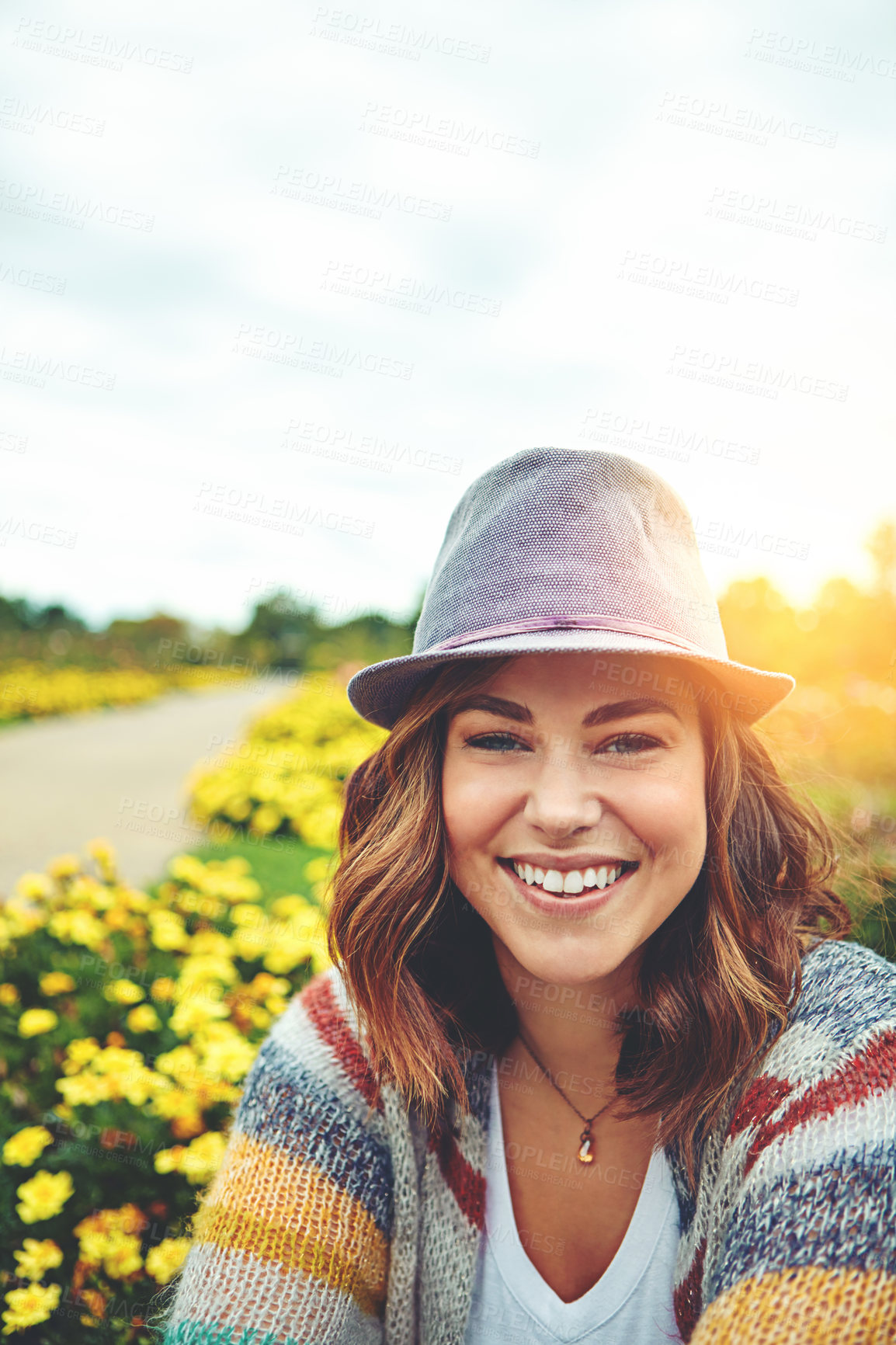 Buy stock photo Portrait of an attractive young woman enjoying a spring day outdoors