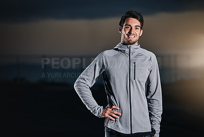 Buy stock photo Shot of a handsome young man exercising outdoors