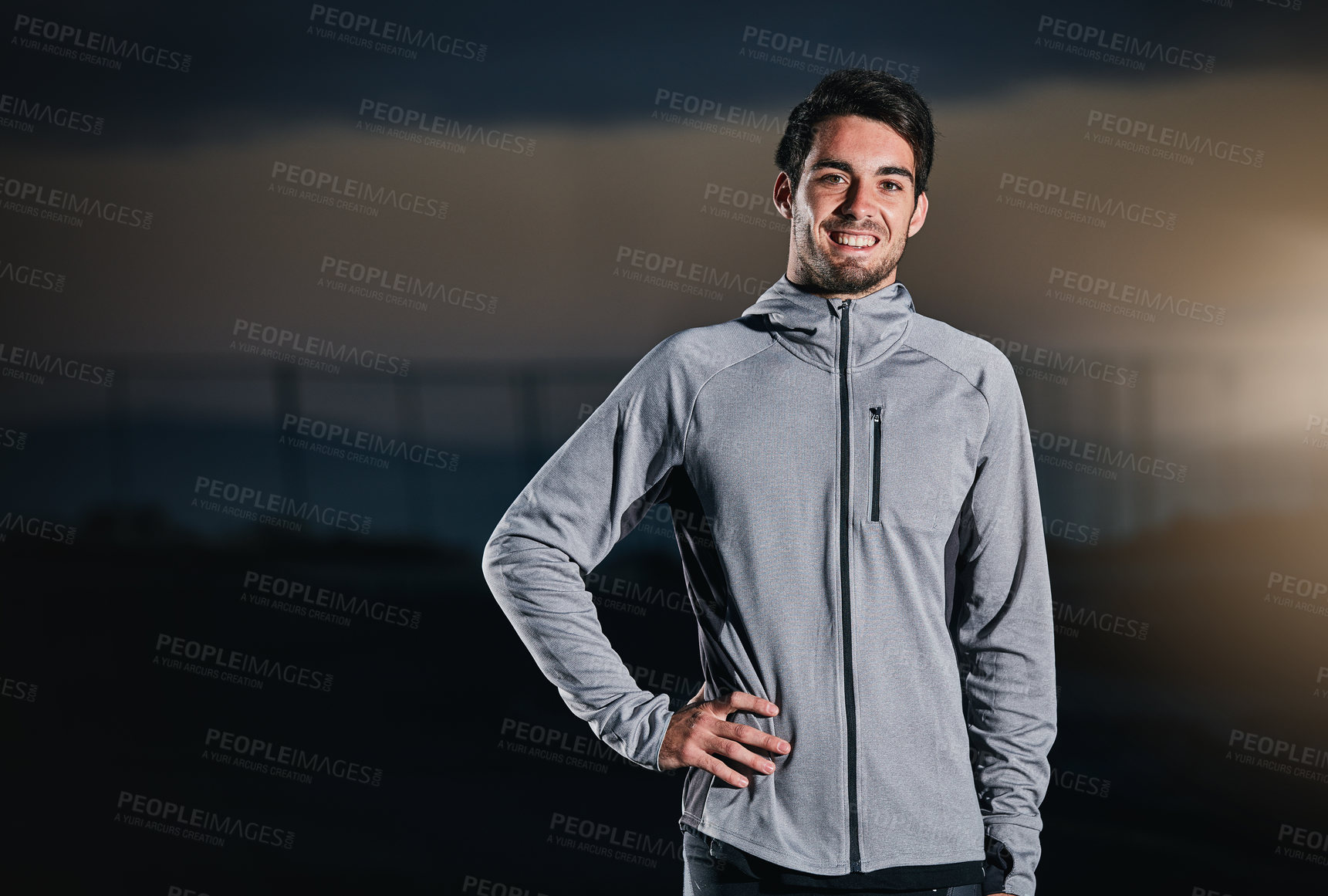 Buy stock photo Shot of a handsome young man exercising outdoors