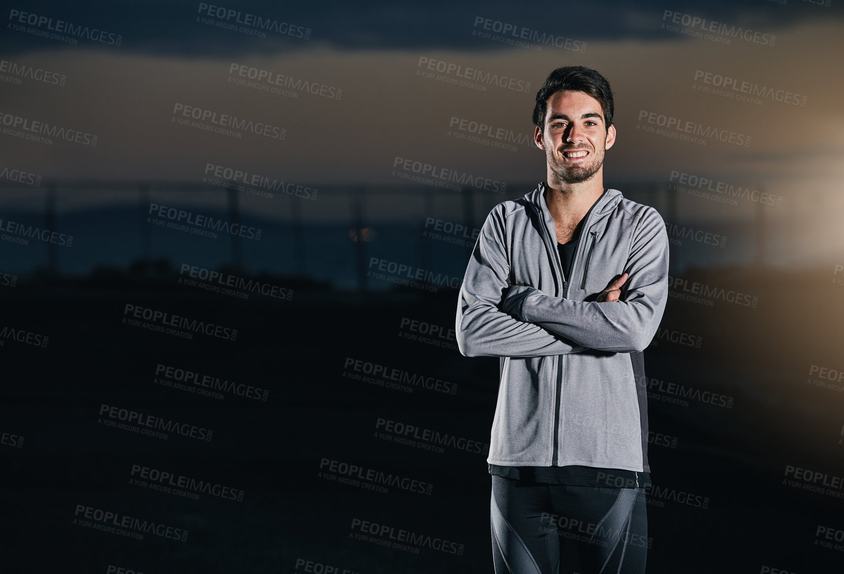 Buy stock photo Shot of a handsome young man exercising outdoors