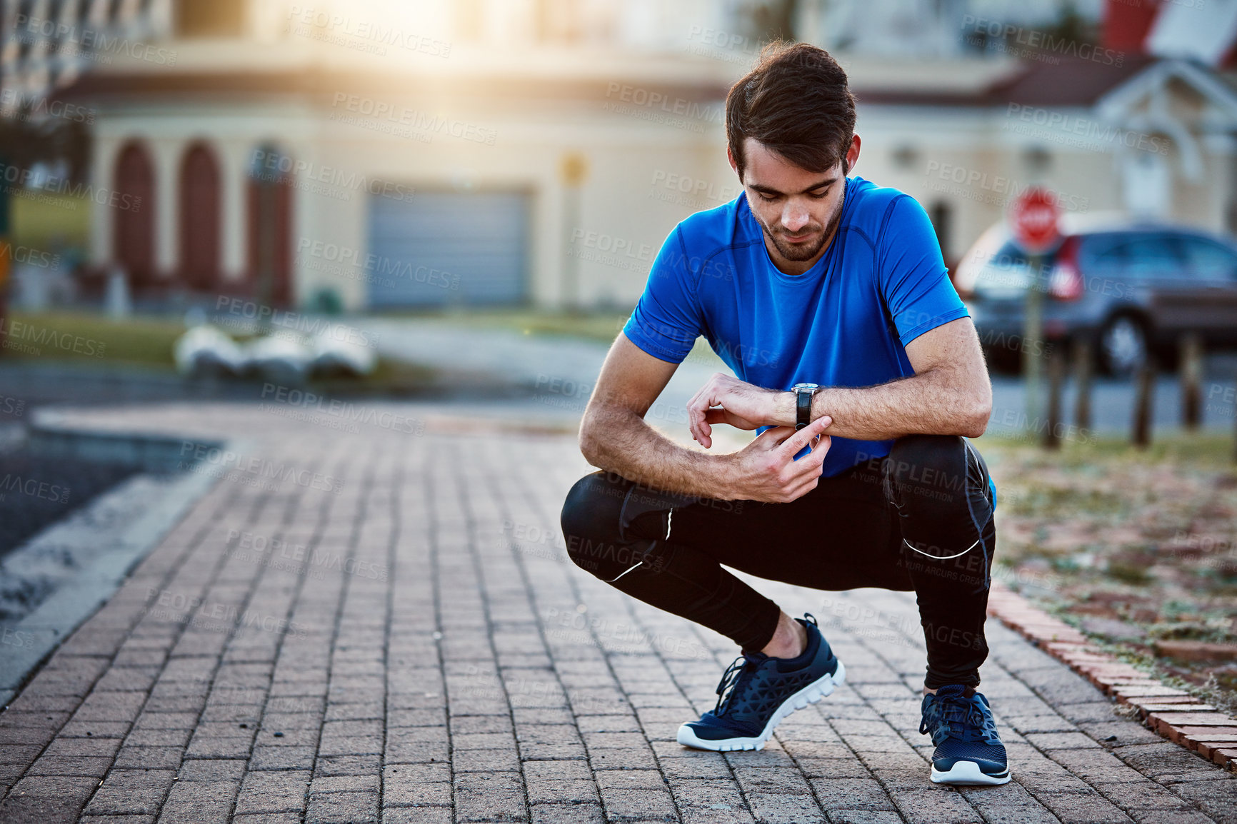 Buy stock photo Shot of a handsome young man exercising outdoors