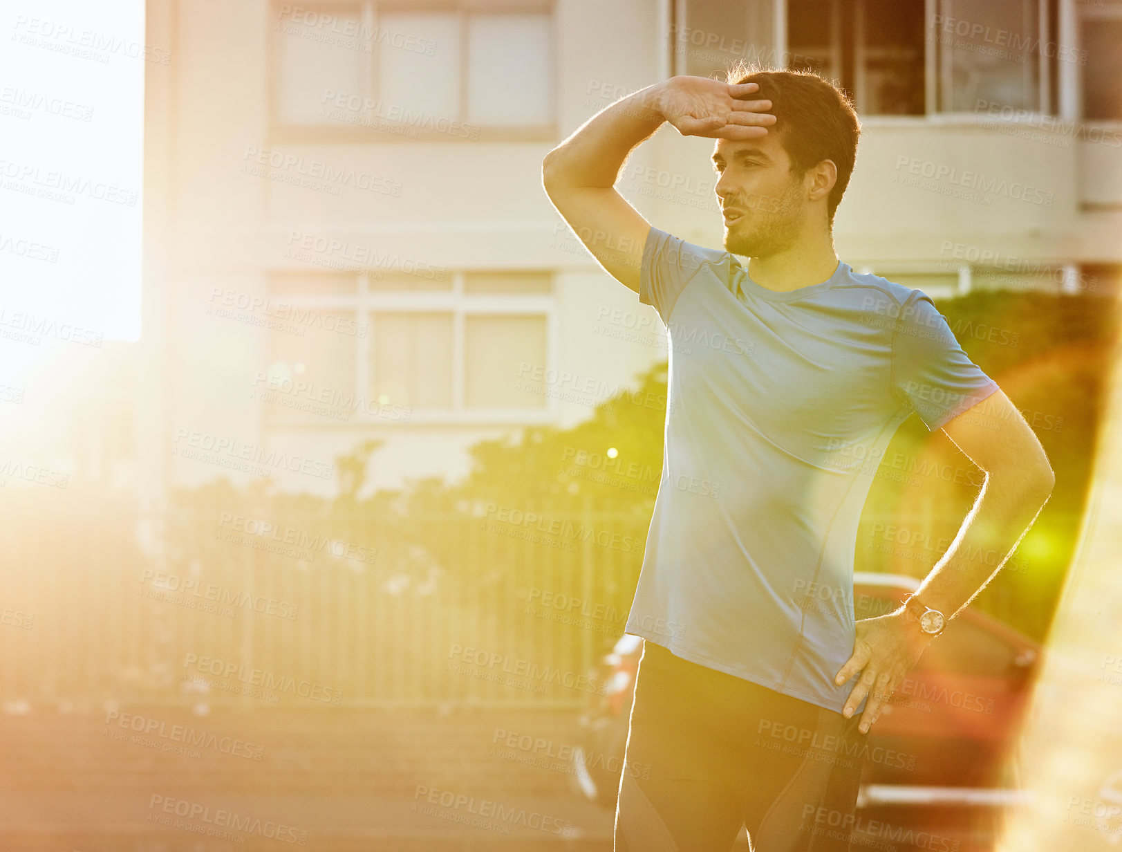 Buy stock photo Shot of a handsome young man exercising outdoors