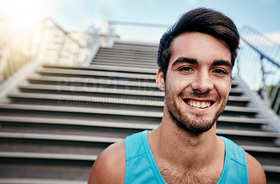 Buy stock photo Cropped portrait of a handsome young man working out in the city
