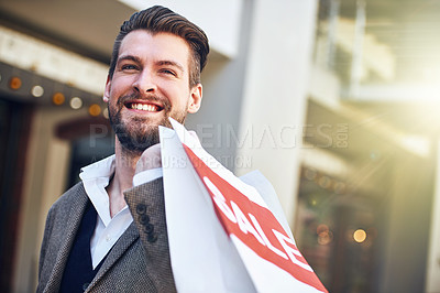Buy stock photo Cropped shot of a young man holding a shopping bag