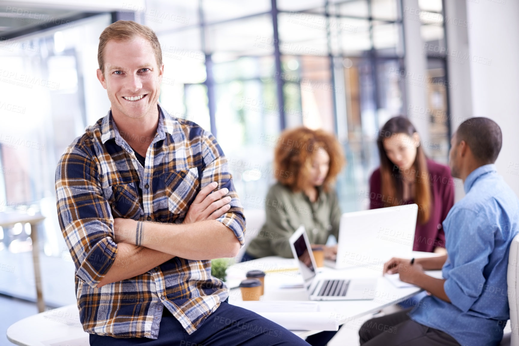 Buy stock photo Portrait, meeting and businessman with arms crossed in office for teamwork, review or planning. Company, smile and employee for collaboration, discussion or professional at interior design agency