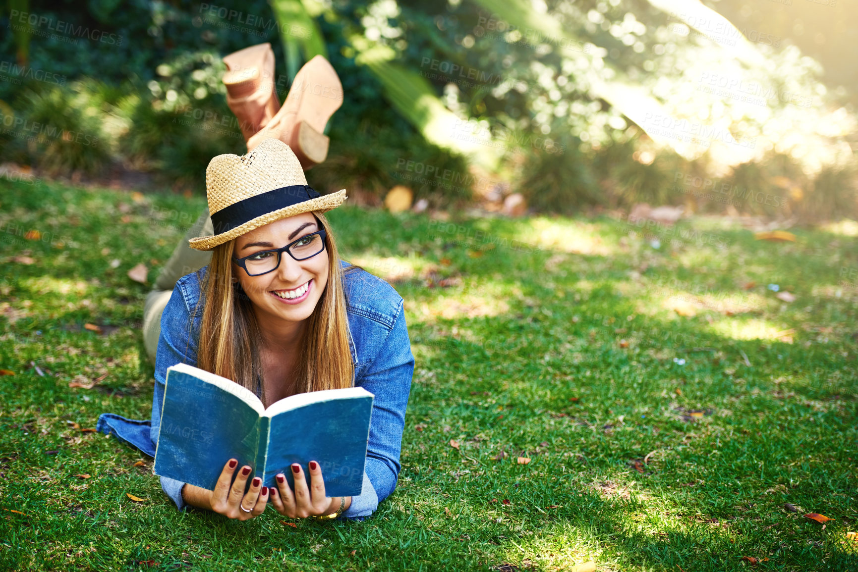 Buy stock photo Park, thinking and girl with book for reading, learning and knowledge with smile outdoor. Nature, female student and novel for entertainment, romance and English literature for language improvement