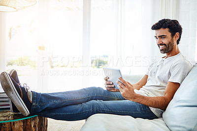Buy stock photo House, man and tablet on sofa for internet, chat and online conversation at home. Living room, male person and digital app for streaming movies, games and social media with technology to relax