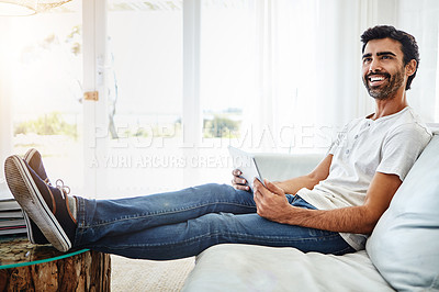 Buy stock photo Thinking, man and tablet on sofa for networking, chat and online conversation at home. Living room, male chatter and mobile app for streaming movies, games and social media with technology to relax