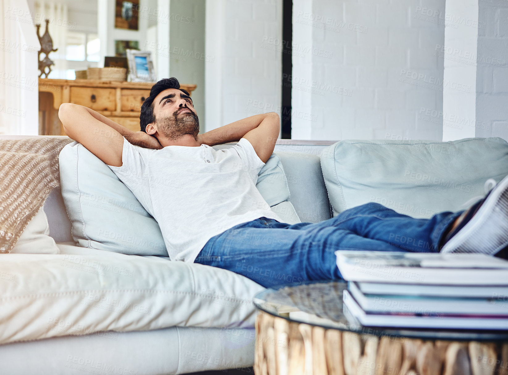 Buy stock photo Relax, lying and man on couch for leisure, peaceful and weekend break in living room. Lazy Saturday, calm and male person with arms out on couch for cozy, comfortable rest or chill day off in home