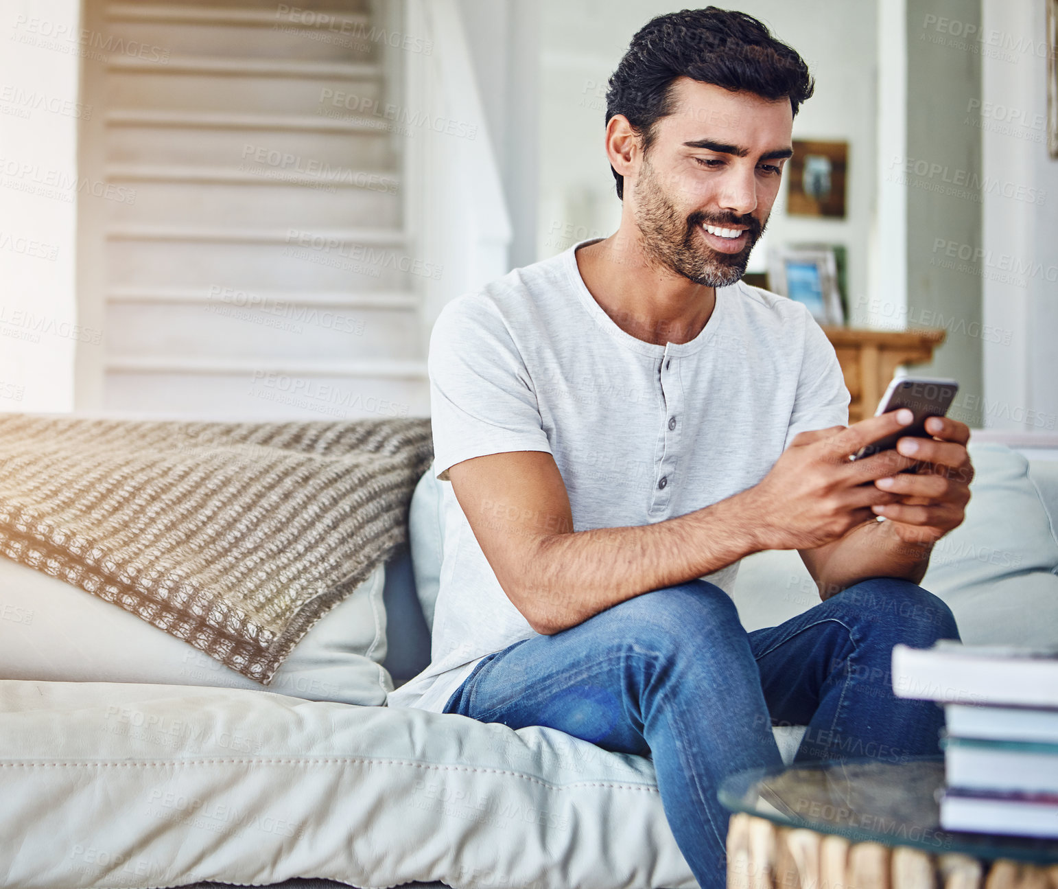 Buy stock photo Man, phone and browsing internet on sofa for networking, communication or social media in living room. Online, connection and person on couch for notification, text message or website app in home