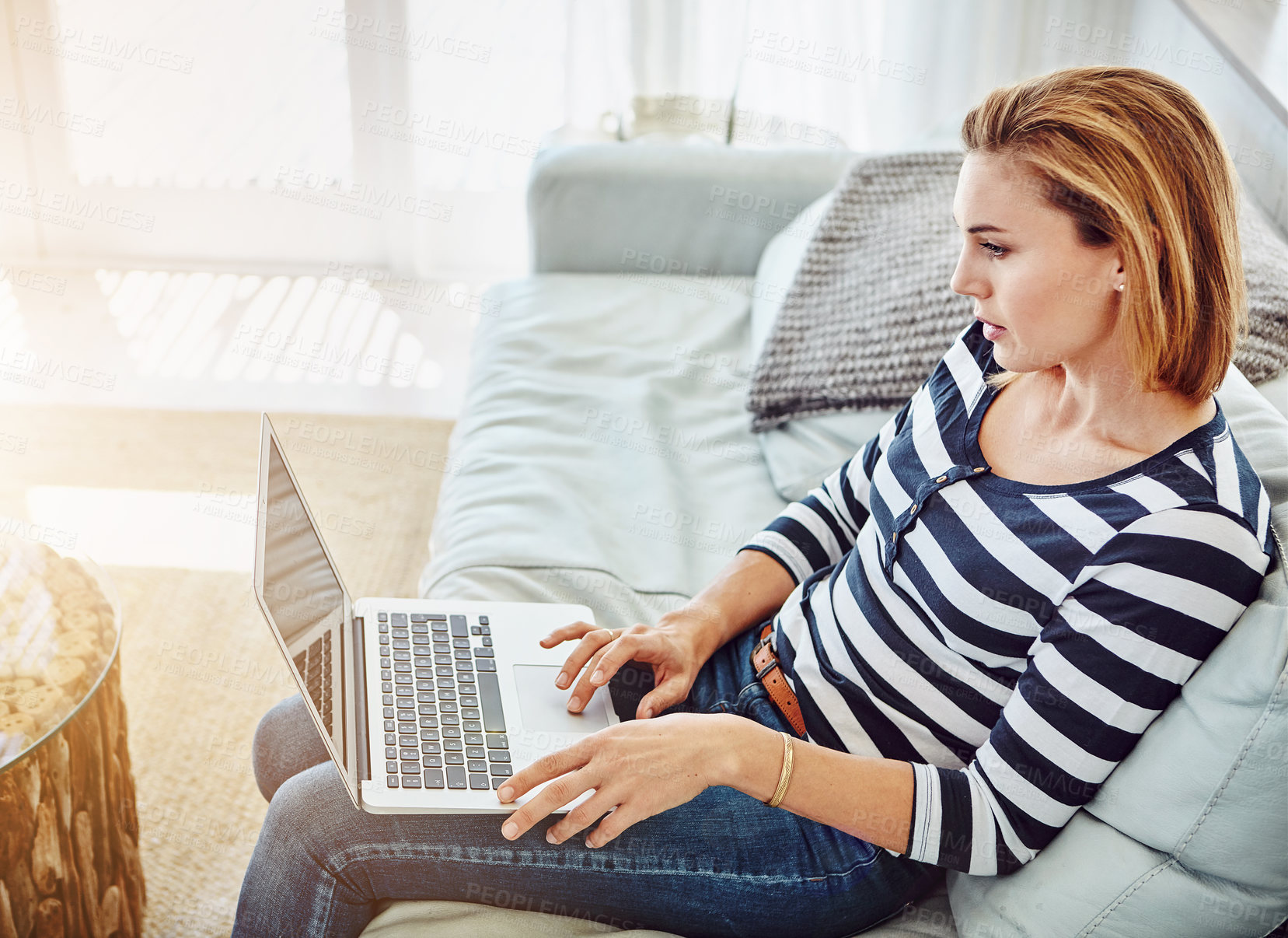 Buy stock photo Woman, computer and home with typing for remote work in startup, digital career on couch. Female freelancer, graphic designer and laptop with research for website development, creative with plan