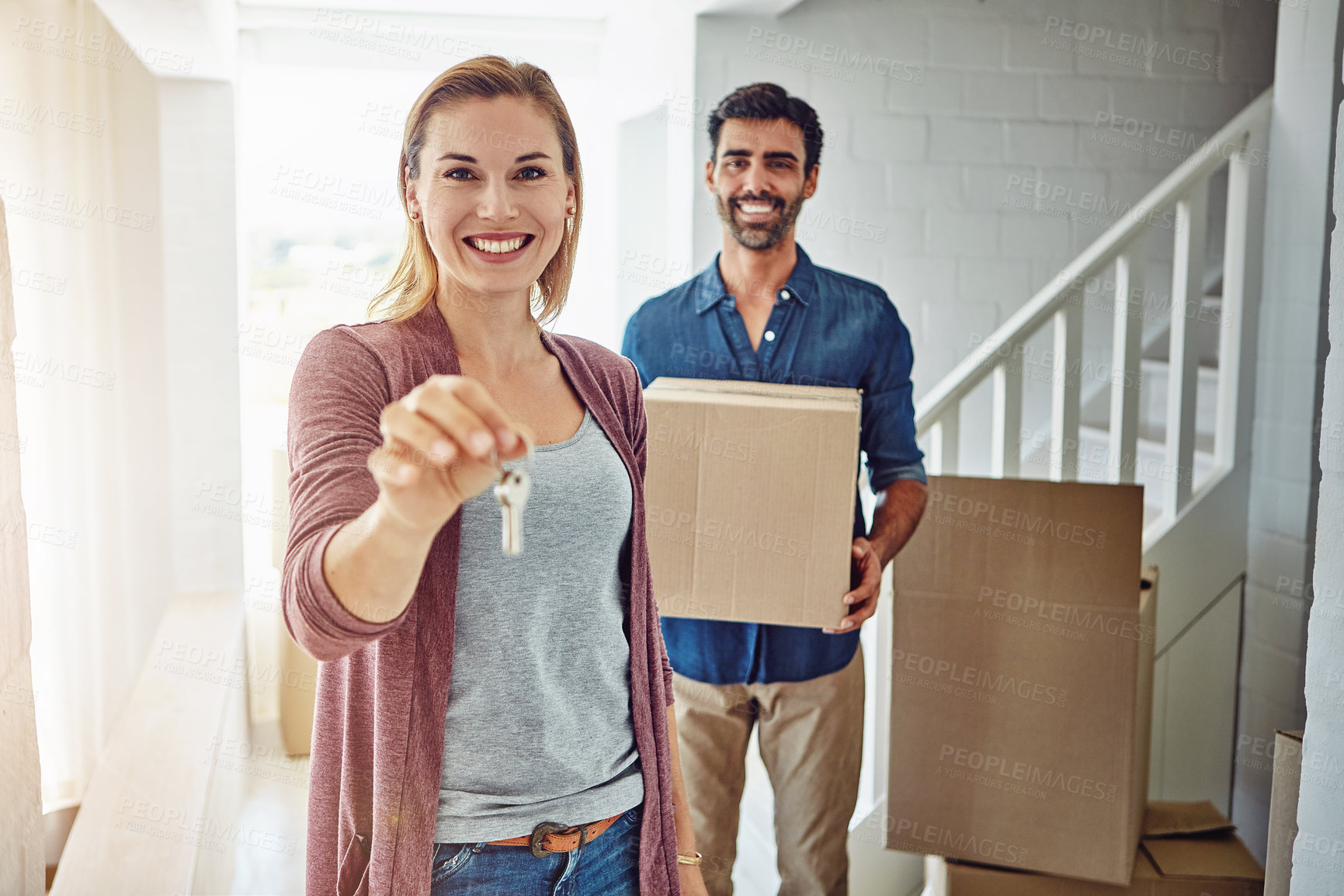 Buy stock photo Portrait of a couple moving into their new home