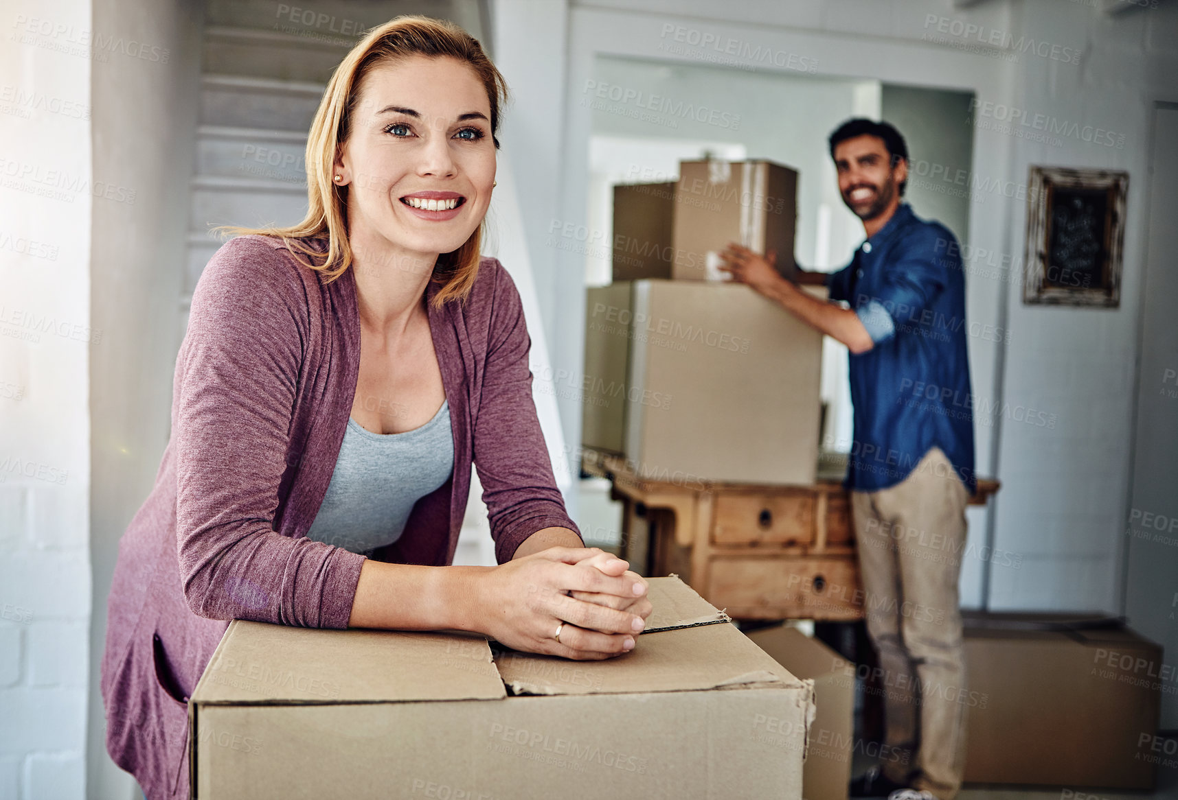 Buy stock photo Shot of a couple moving into their new home