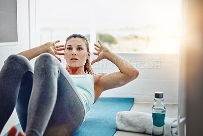 Buy stock photo Shot of a woman strengthening her core muscles
