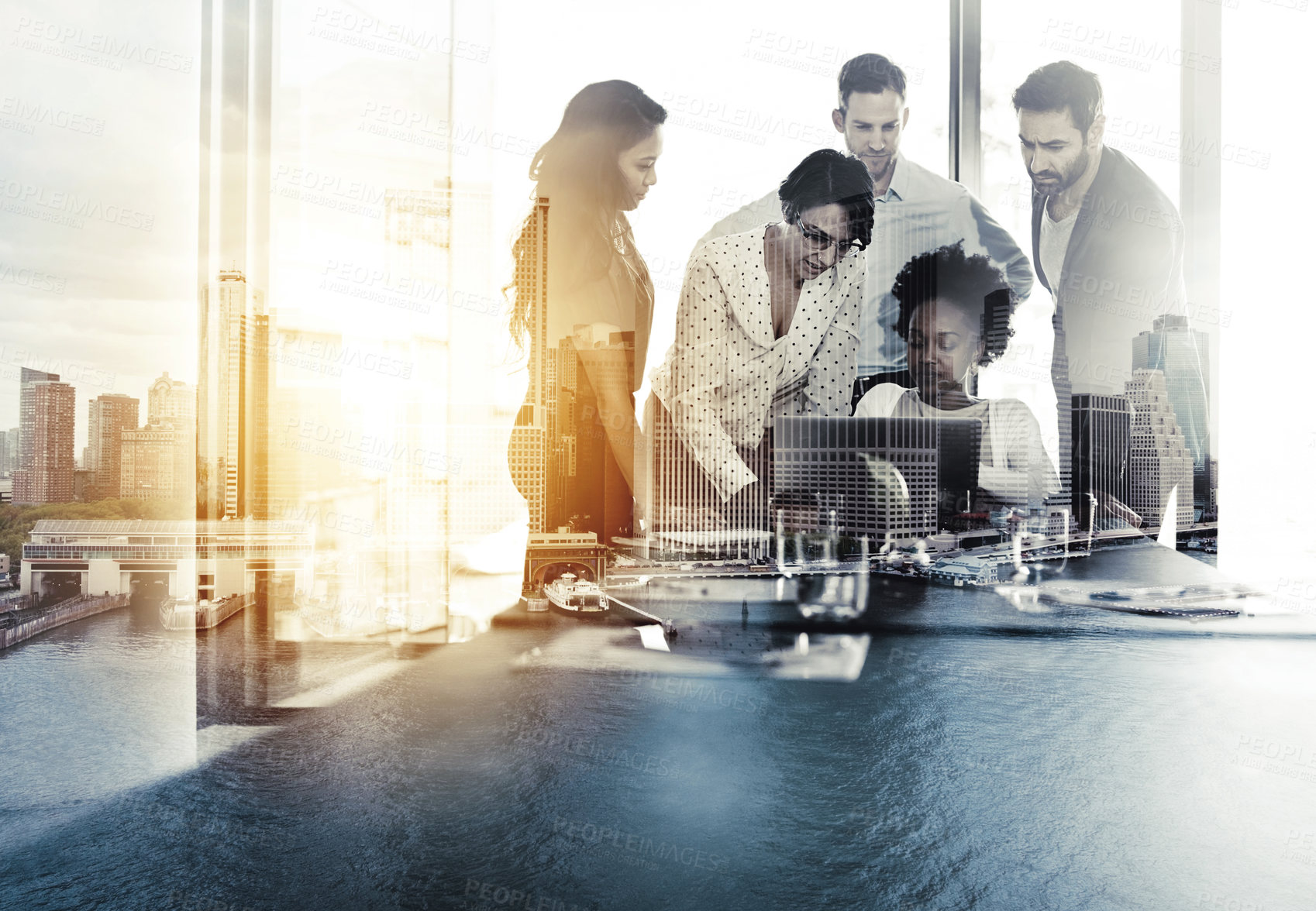 Buy stock photo Digitally enhanced shot of a group of colleagues gathered around a laptop in the office