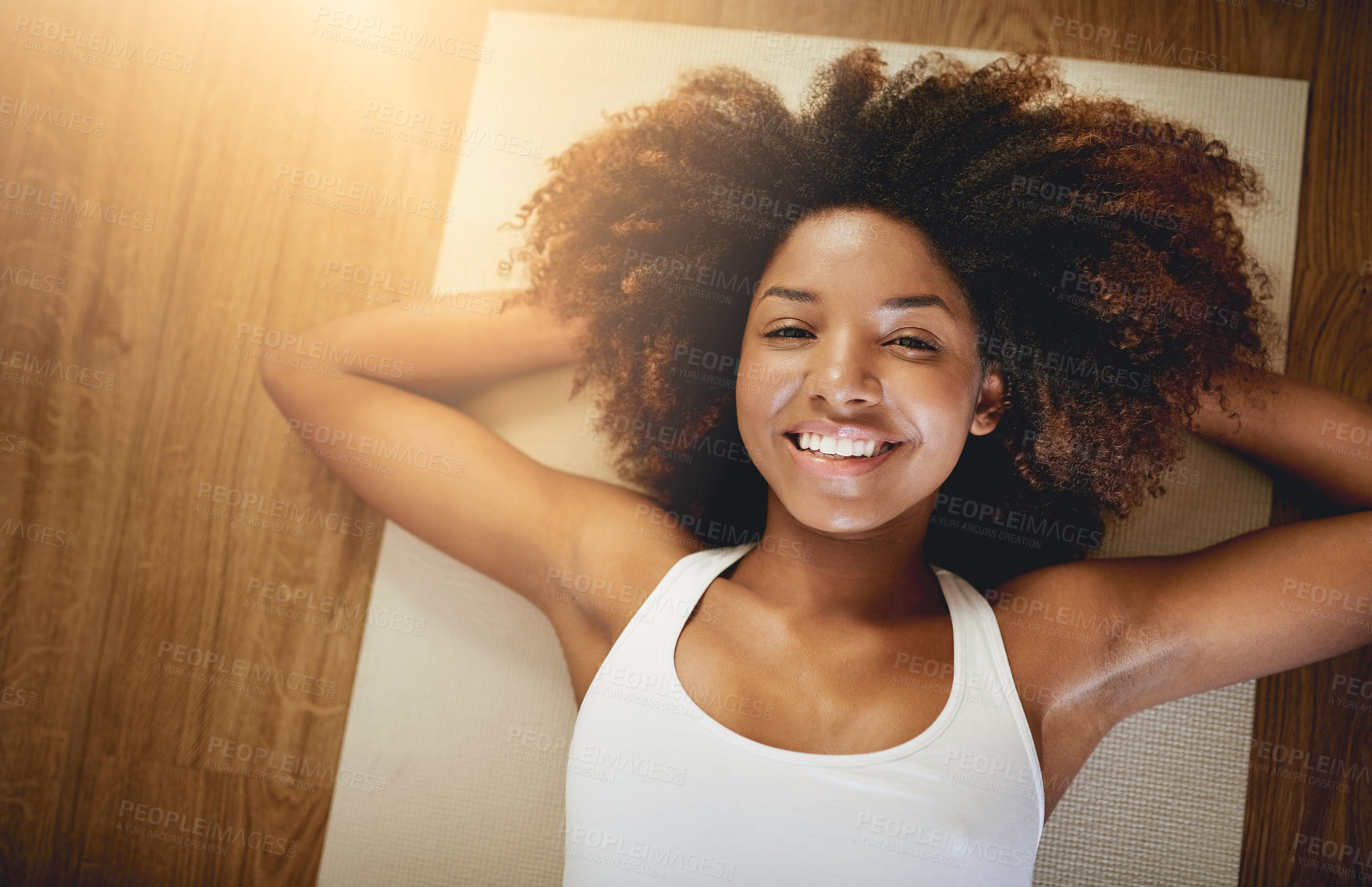 Buy stock photo Portrait, sweat and yoga with black woman on floor from above for break from exercise or wellness routine. Afro, face and flare with smile of happy African yogi person on mat for holistic fitness