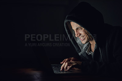 Buy stock photo Dark, basement and man at laptop for hacking, online programming and cybersecurity at night. Software, developer or hacker in hoodie coding for password, firewall or network access for cyber attack