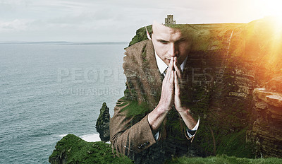 Buy stock photo Shot of a focussed young businessman superimposed over a beautiful landscape