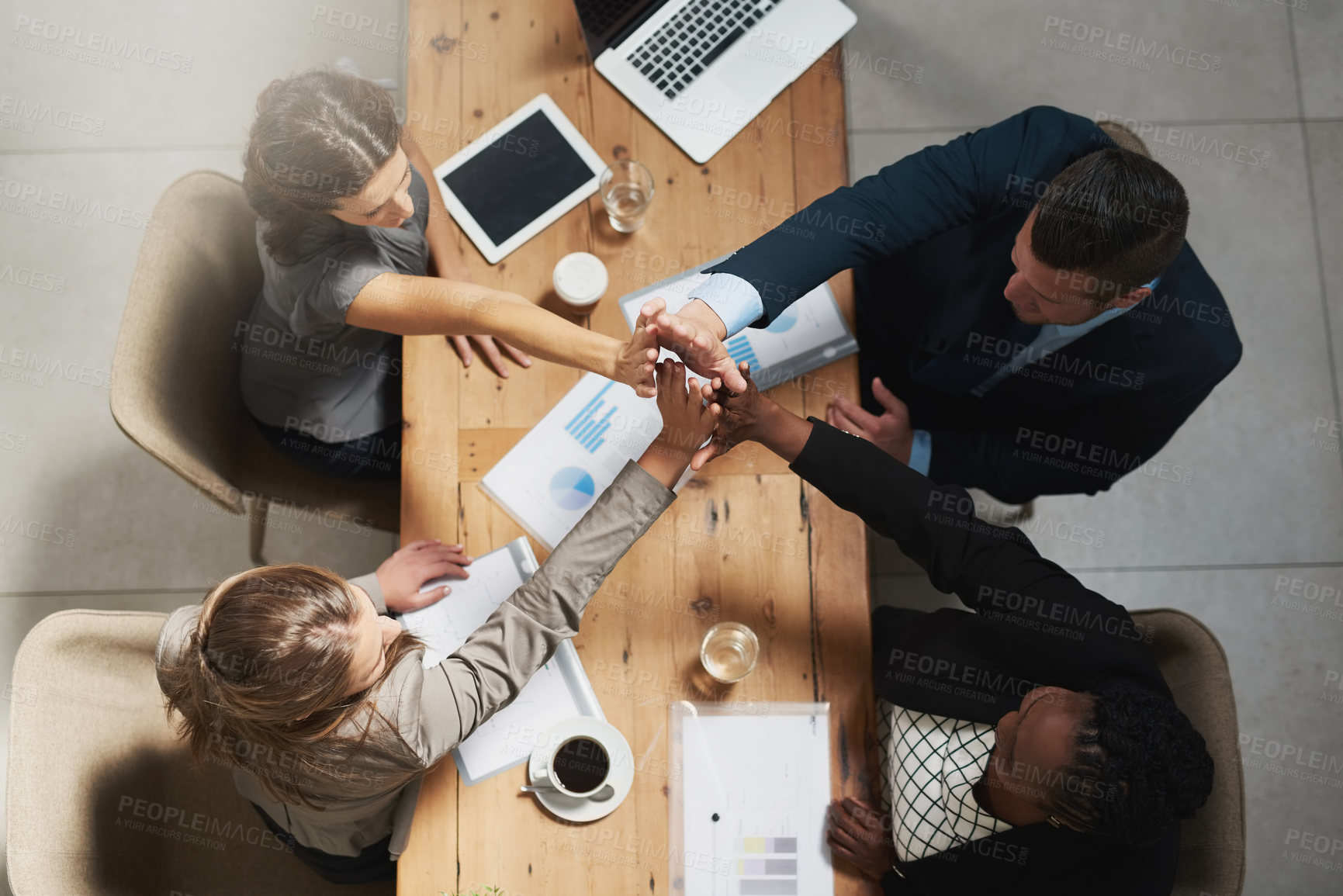 Buy stock photo People, high five and business meeting success at table with documents above for teamwork at office. Top view of group hands in solidarity or motivation for team building, agreement or collaboration