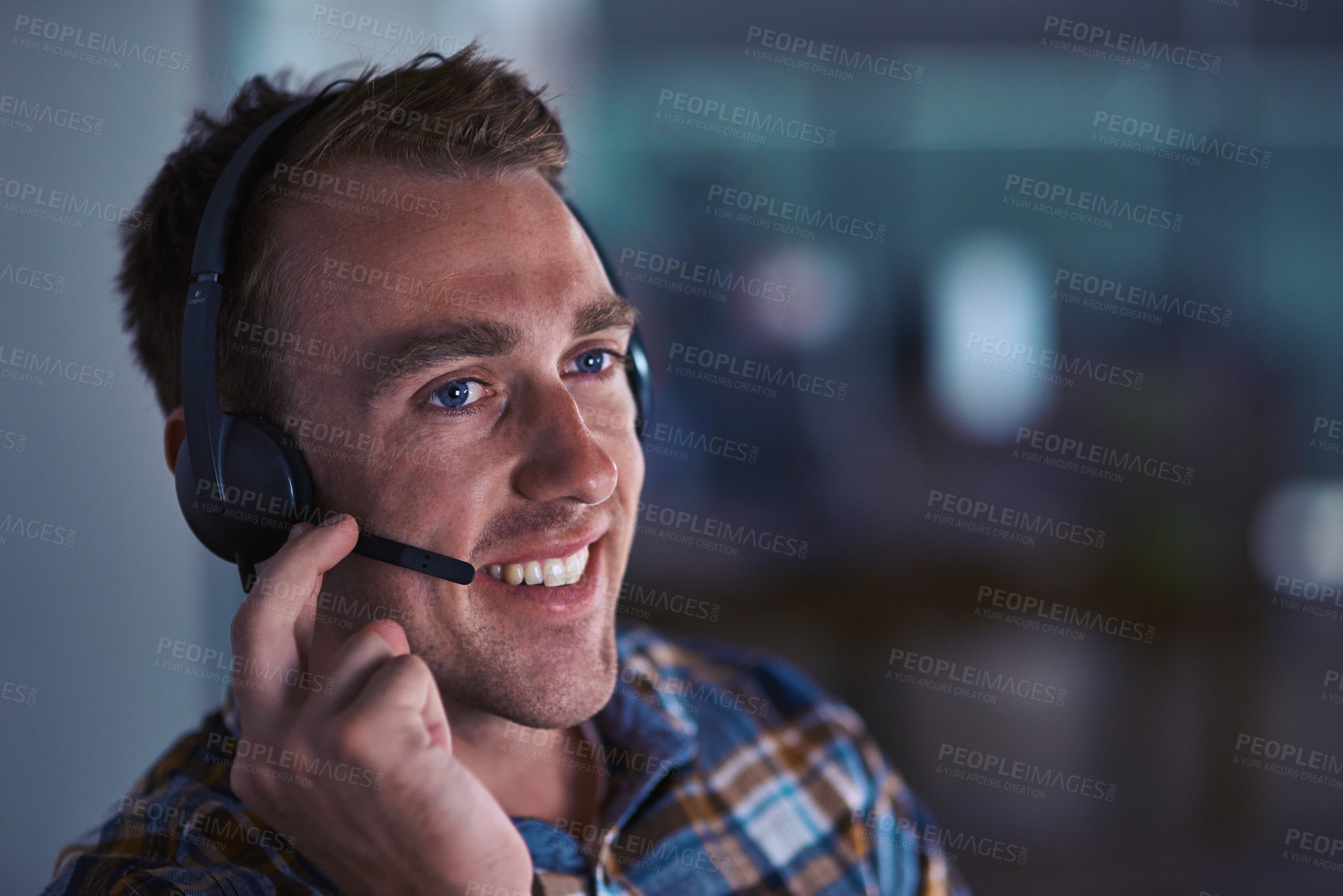 Buy stock photo Shot of a happy customer service agent wearing a headset while sitting in the office