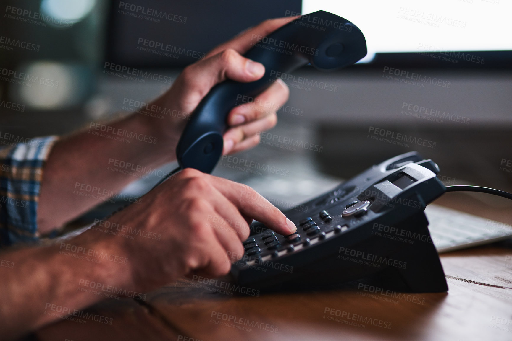 Buy stock photo Man, hands and desk phone dialing for call,  communication and administrator tech on table. Contact, typing and client update with receptionist, business extension and professional employee working