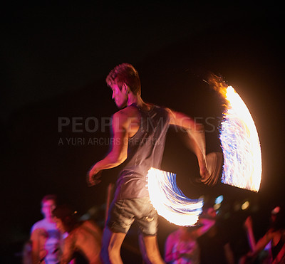 Buy stock photo Shot of a fire performance on a beach in Thailand