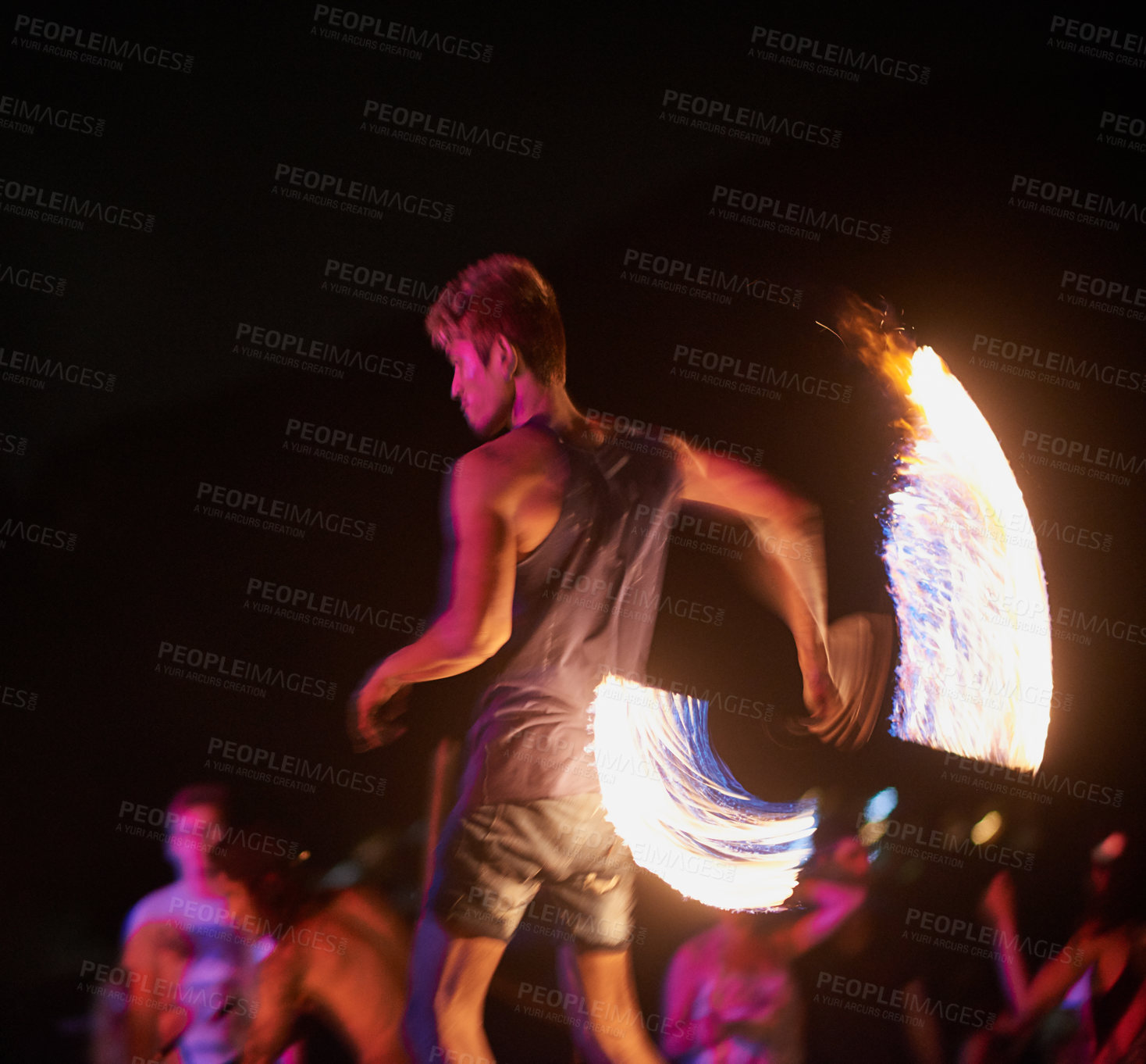 Buy stock photo Shot of a fire performance on a beach in Thailand