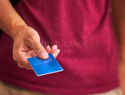 Buy stock photo Cropped closeup shot of a man handing over a credit card