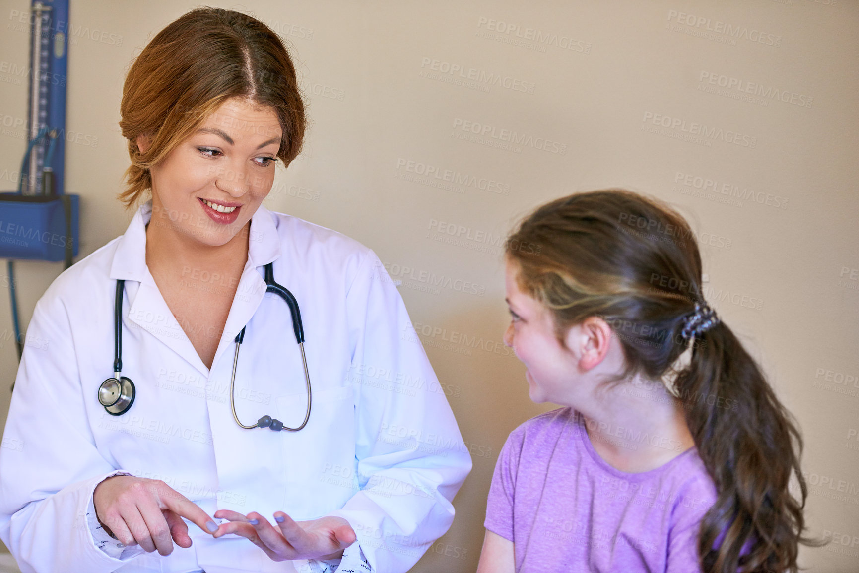 Buy stock photo Doctor, child and patient in consultation for healthcare with discussion, medical symptoms and health support. Pediatrician, girl and professional with talking for prescription, helping and happy