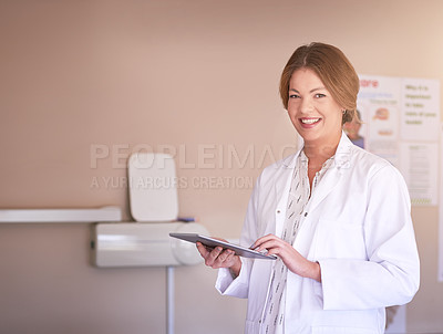 Buy stock photo Portrait of a female dentist using her tablet in her office