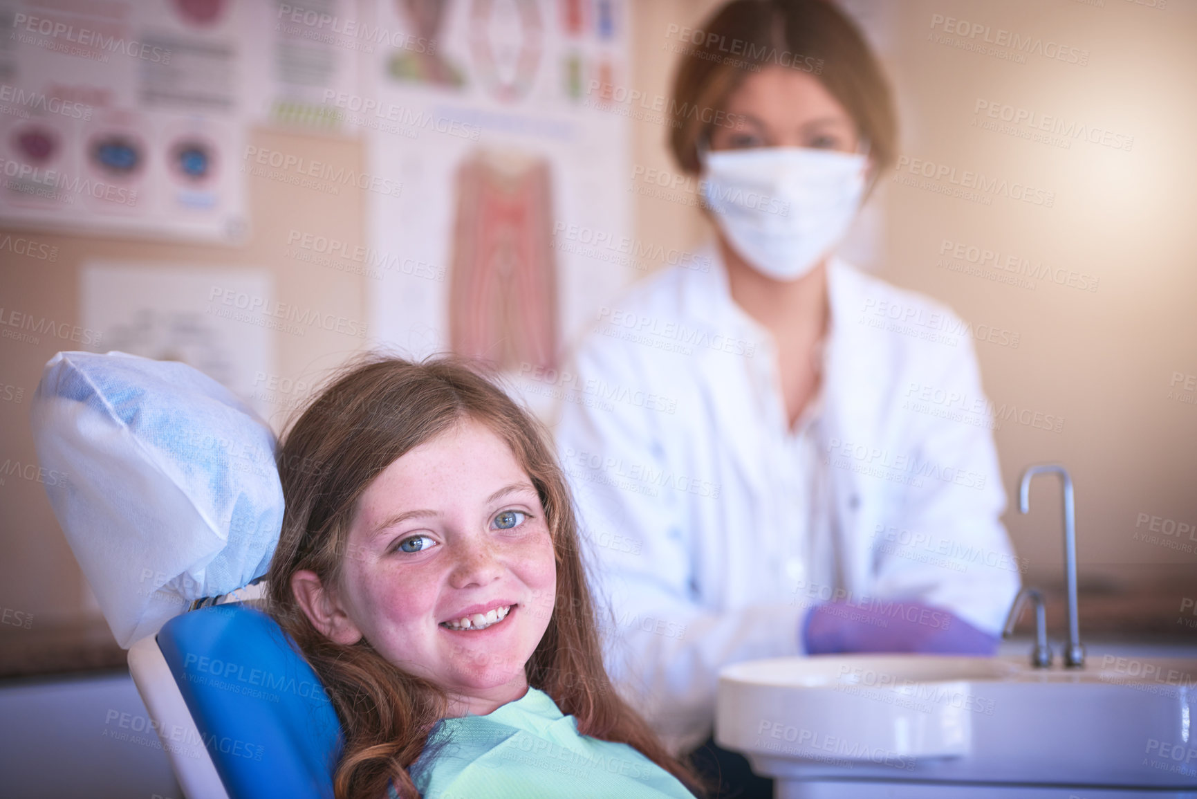 Buy stock photo Shot of a little girl at the dentist for a checkup