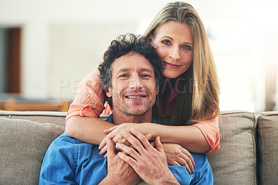 Buy stock photo Portrait of a happy mature couple having a relaxed day together at home