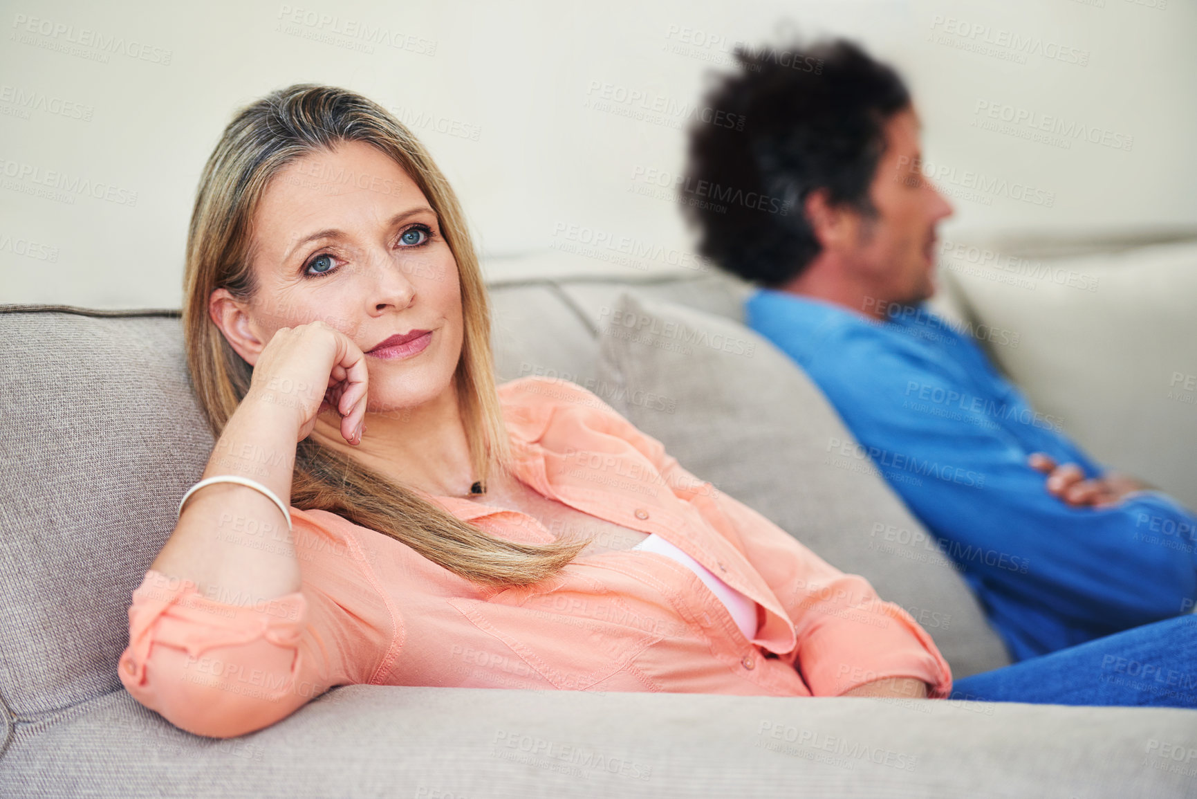 Buy stock photo Shot of a mature couple not speaking to each other after a disagreement at home