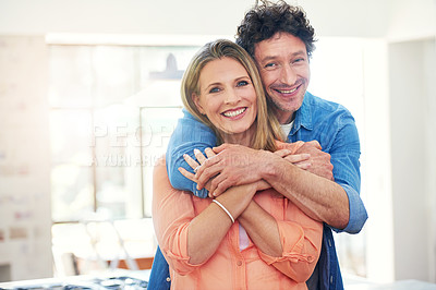 Buy stock photo Portrait of a happy mature couple sharing an affectionate moment at home