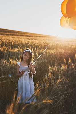 Buy stock photo Child, letter and balloons outdoor in cornfield for communication, wish and message to the sky for fantasy with mockup. Girl, kid and paper in field with travel, innocent and post with sunlight