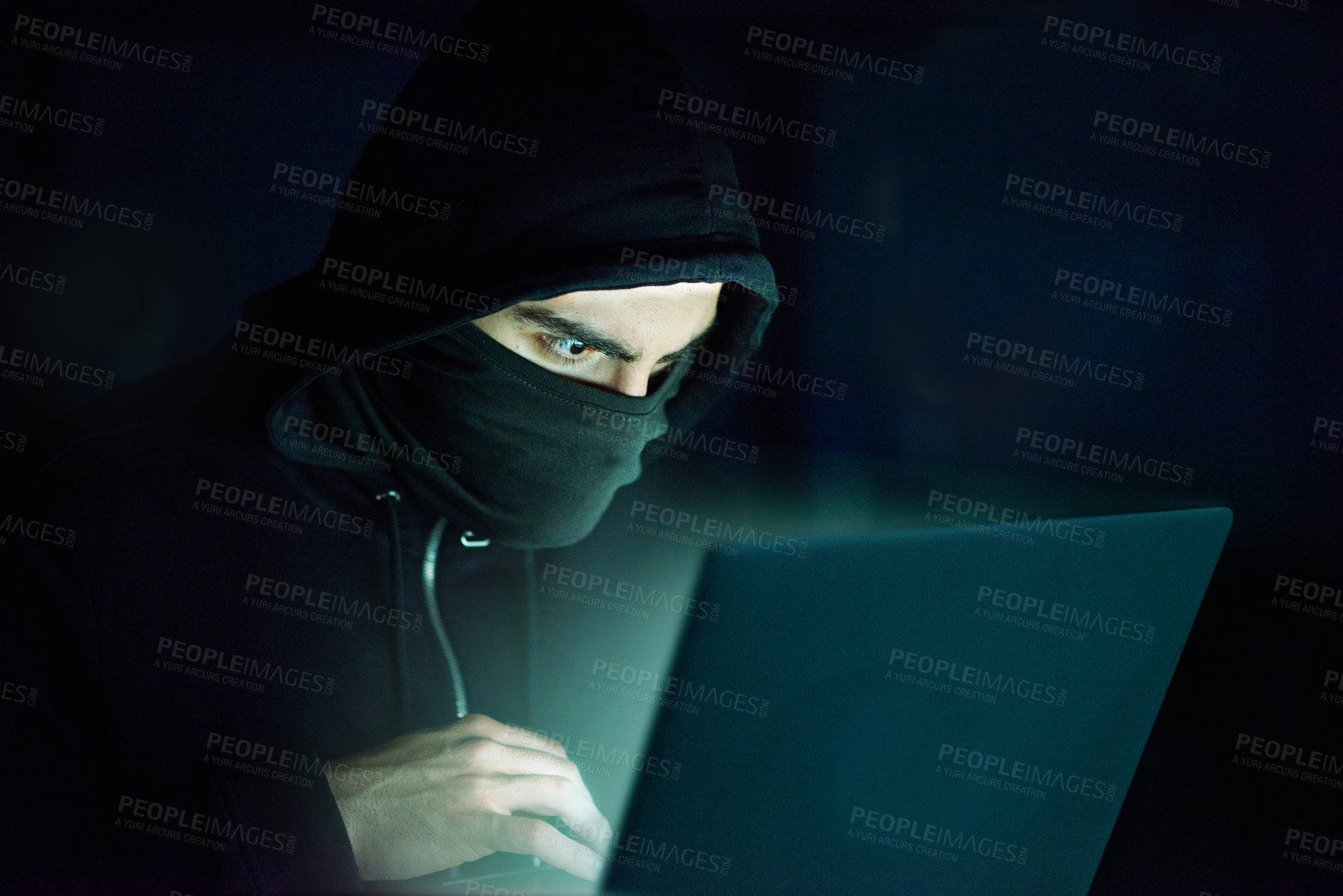 Buy stock photo Man, laptop and hoodie on black background for hacking, phishing and malware with virus. Hacker, technology and software for cyber crime, hacktivism or information spy with programming or coding