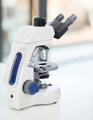 Buy stock photo Shot of a microscope in an empty laboratory