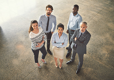 Buy stock photo High angle portrait of a group of businesspeople standing together in an office lobby