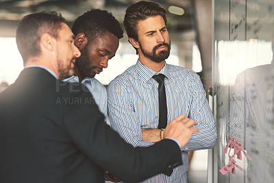 Buy stock photo Thinking, men and whiteboard presentation in office for planning schedule, information and staff reminder. People, brainstorming and meeting with notes, teamwork and feedback for project proposal