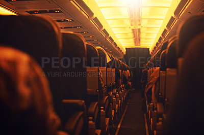 Buy stock photo Shot of passenger seating inside an airplane