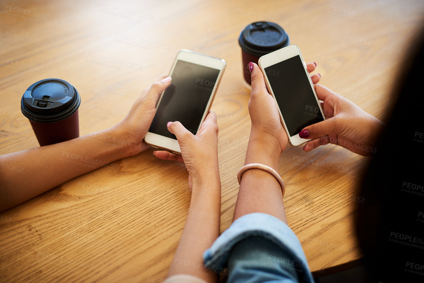 Buy stock photo Communication, hands and people with cellphone and coffee typing email, text message or post in cafe. Technology, contact and women with cappuccino and phone for networking on internet in restaurant.